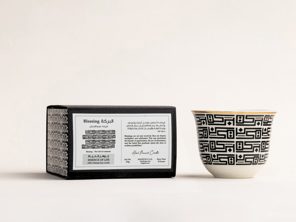 AKUN Essence of Life candle featuring the Baraka design, with Arabic-inspired calligraphy symbolising blessings, shown with its box on a clean white background