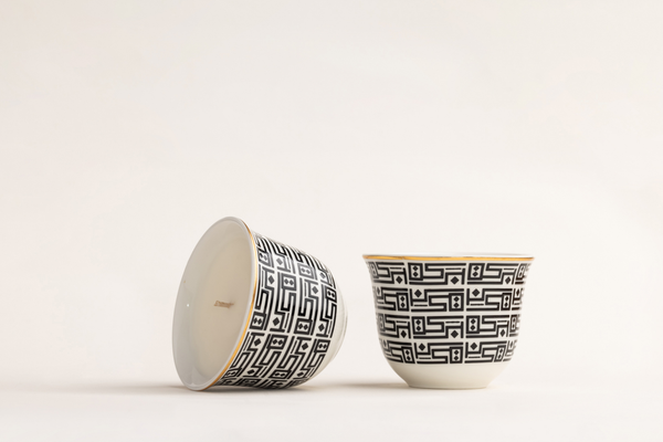 AKUN Essence of Life candle cups featuring the Baraka Arabic geometric pattern, shown in a minimal studio setting highlighting the design and craftsmanship