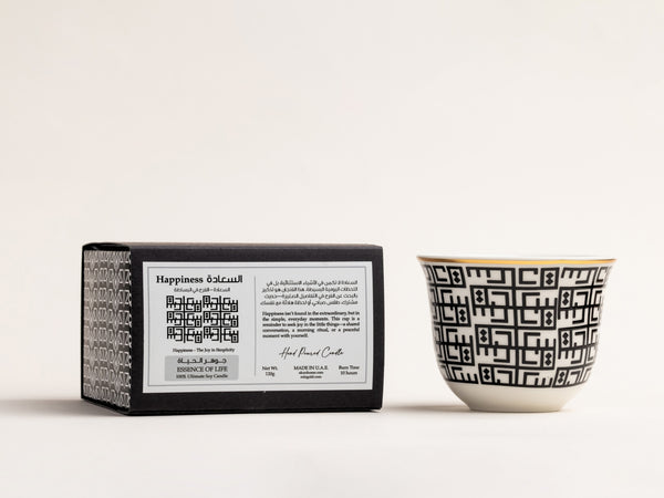 AKUN Essence of Life Saada candle featuring Arabic geometric pattern symbolising happiness, shown with branded packaging in a minimalist studio setting