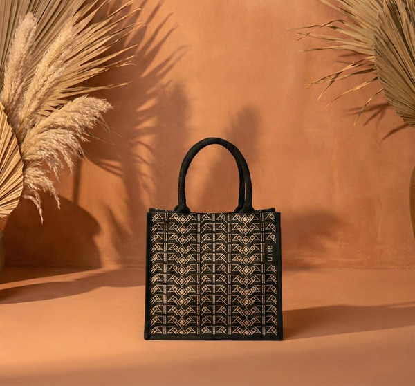 AKUN luxury tote bag featuring an Arabic-inspired geometric pattern, styled against a warm neutral backdrop for elegant gifting and everyday use