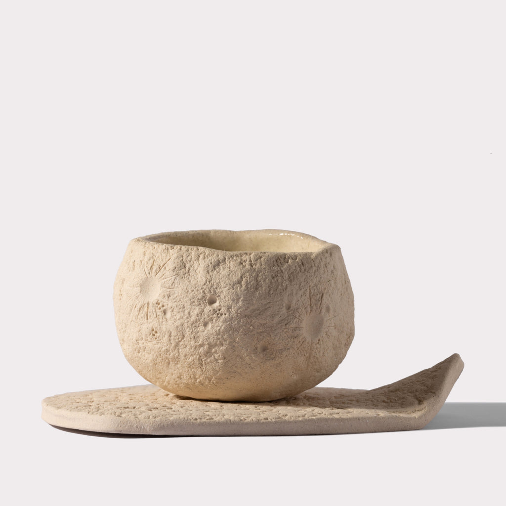 Moon-inspired sculptural candle vessel from AKUN Noor Al Qamar collection with crater-textured surface
