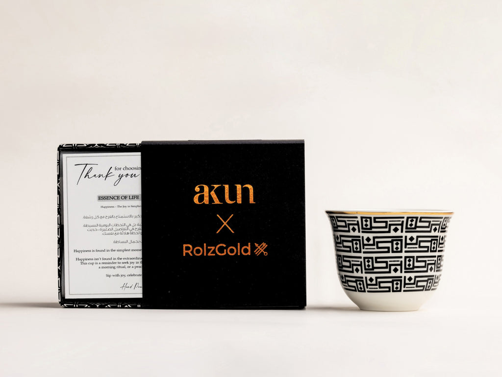 AKUN x RolzGold Essence of Life candle featuring the Baraka design, shown with collaborative packaging and an Arabic-inspired patterned cup on a white background