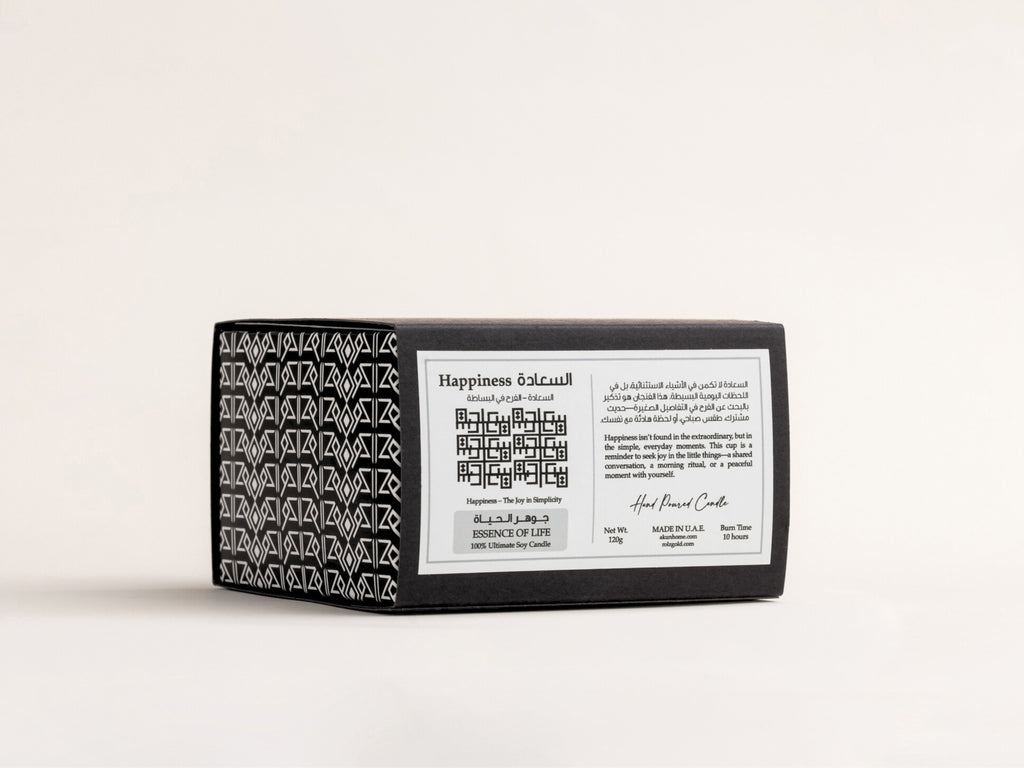 AKUN x RolzGold Essence of Life Saada candle packaging featuring bilingual label and geometric Arabic pattern
