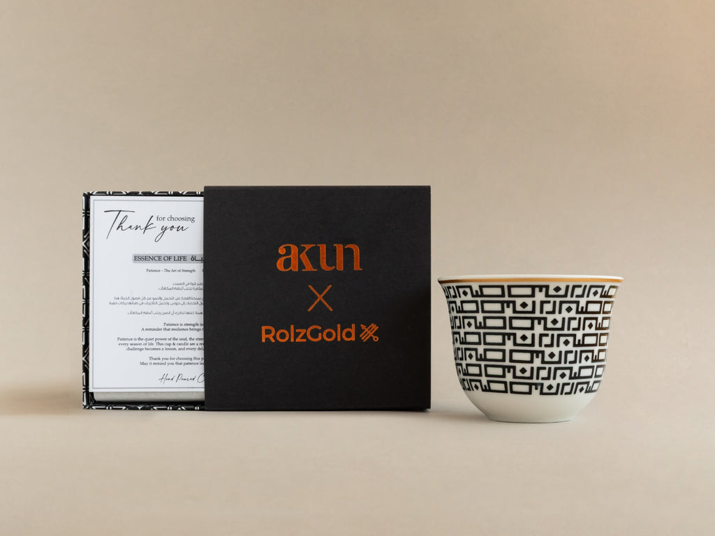AKUN x RolzGold Essence of Life Sabr candle shown with collaboration gift box and Arabic patterned ceramic cup