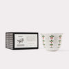 AKUN Scents of Arabia amber fragrance candle displayed as a minimalist still life with ceramic cup and boxed presentation
