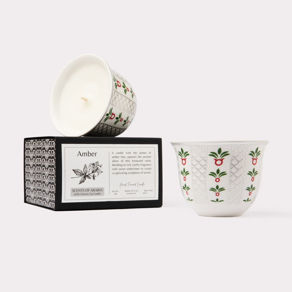 AKUN Scents of Arabia amber candle presented in a silver-toned patterned ceramic cup with signature box