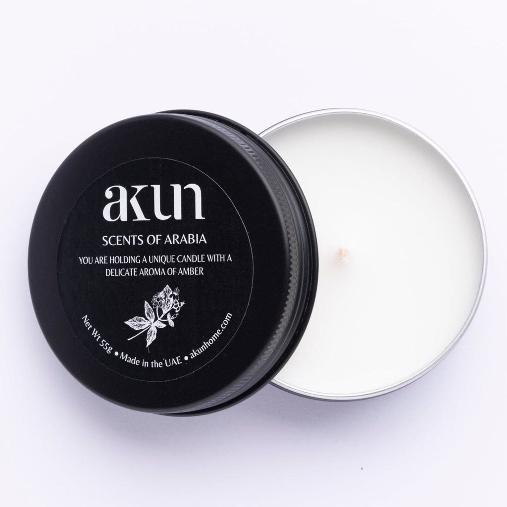 AKUN Scents of Arabia amber travel tin candle with black lid and white wax, compact scented candle made in the UAE