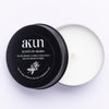 AKUN Scents of Arabia amber travel tin candle with black lid and white wax, compact scented candle made in the UAE