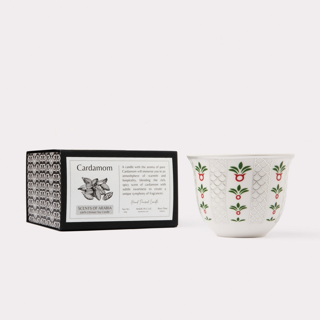 AKUN Scents of Arabia cardamom candle styled with its patterned box and ceramic vessel in a minimalist product composition