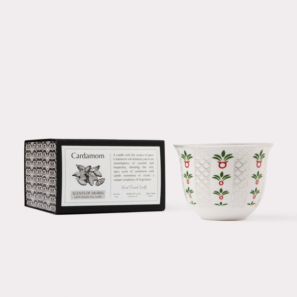 AKUN Scents of Arabia cardamom candle styled with its patterned box and ceramic vessel in a minimalist product composition