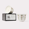 AKUN Scents of Arabia cardamom candle in a silver-patterned ceramic vessel, presented as a contemporary fragrance piece