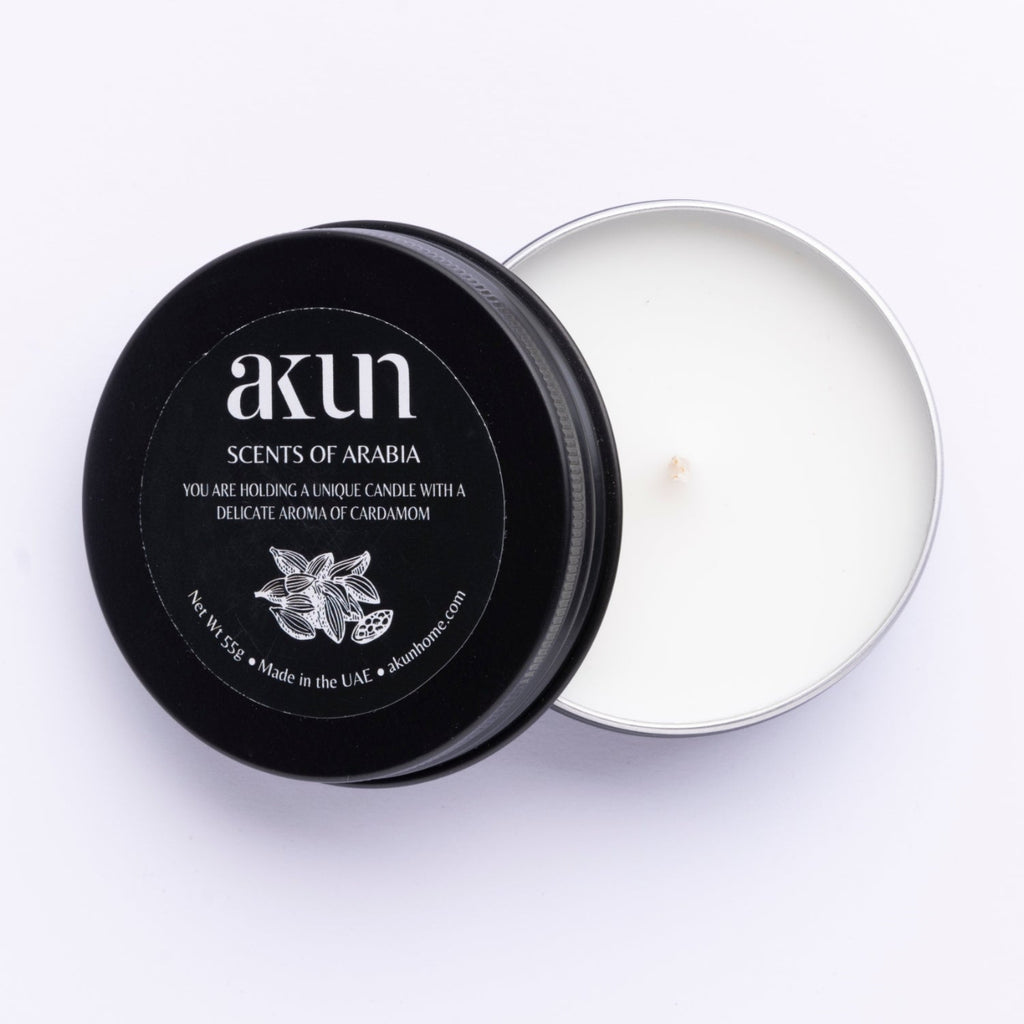AKUN Scents of Arabia cardamom travel tin candle with black lid and white wax, compact scented candle made in the UAE