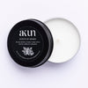 AKUN Scents of Arabia cardamom travel tin candle with black lid and white wax, compact scented candle made in the UAE