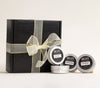 AKUN Scents of Arabia candle discovery gift set styled with ribboned black box and assorted fragrance tins