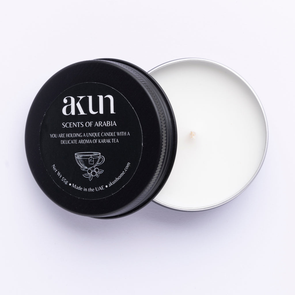AKUN Scents of Arabia karak tea travel tin candle with black lid and white wax, warm spiced Arabian tea scented candle made in the UAE