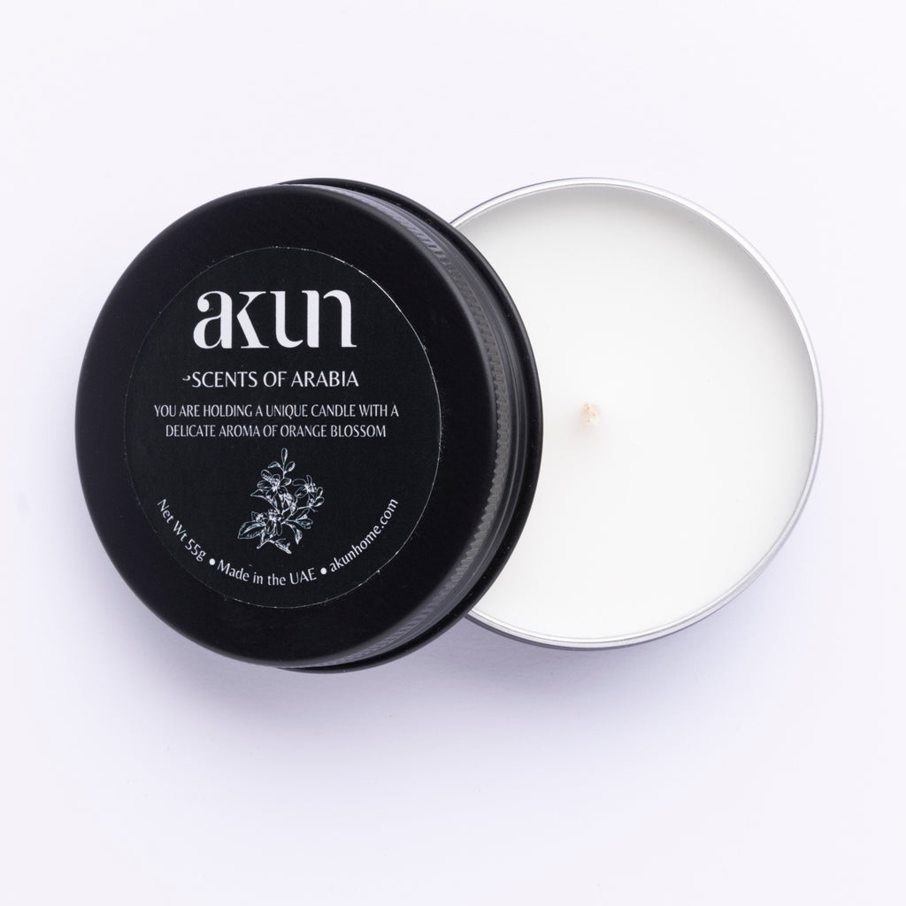 AKUN Scents of Arabia oud blossom travel tin candle with black lid and white wax, a soft floral take on traditional oud fragrance
