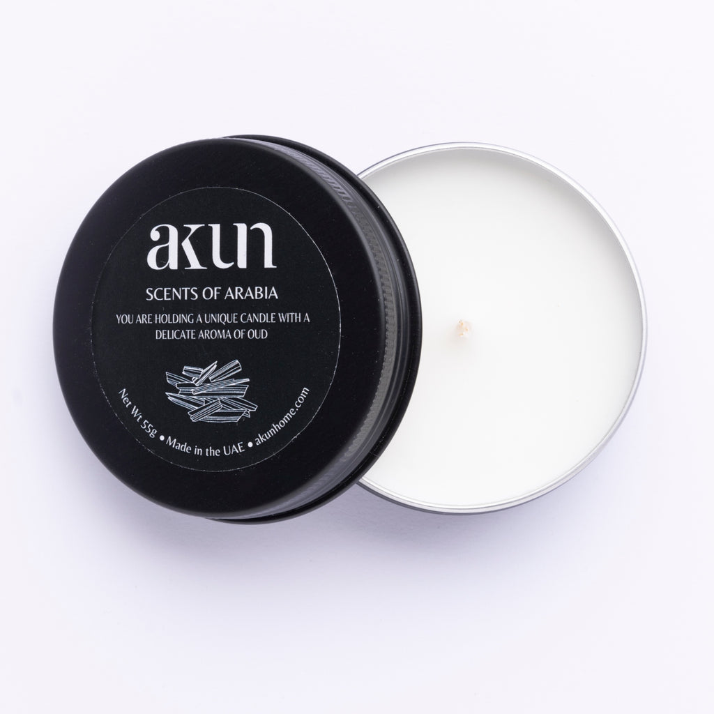 AKUN Scents of Arabia oud travel tin candle with black lid and white wax, rich oud-scented candle inspired by Arabian fragrance traditions